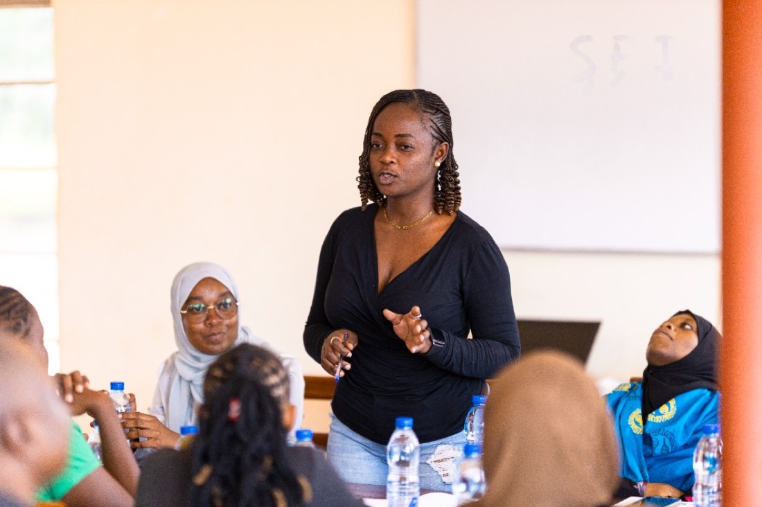 Young woman leading a community dialogue and advocacy session